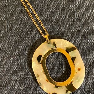 18 inch long adjustable necklace with tortoise shell look gold on back